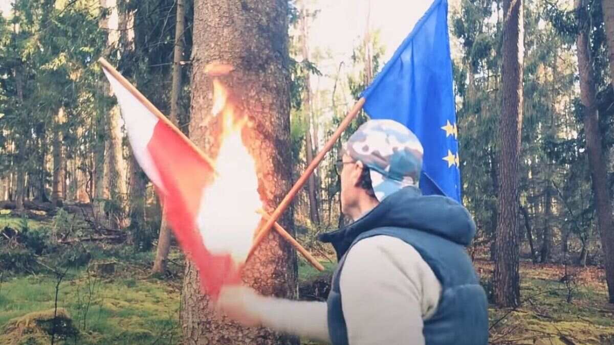 Działacz LGBT niszczący flagę Polski.